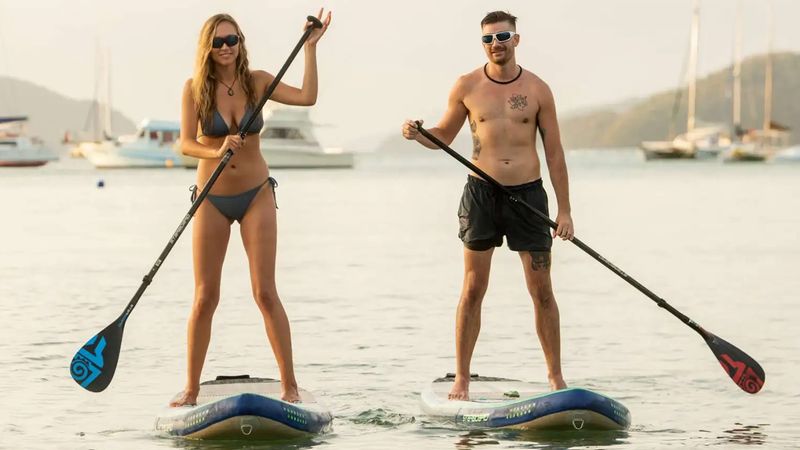 Best kayaking and paddleboarding sunglasses laid on a dock near the water