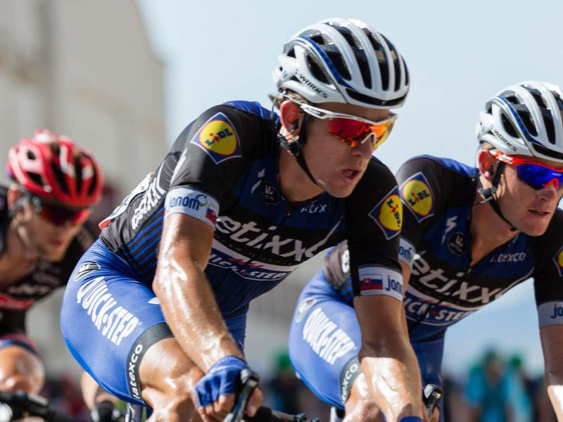 Cycling peloton riders wearing aerodynamic sport sunglasses