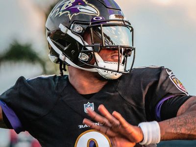 Football player wearing Oakley Prizm visor on helmet